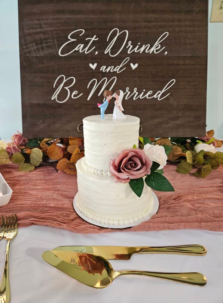 Beautifully decorated custom celebration cake with fresh flowers and elegant frosting